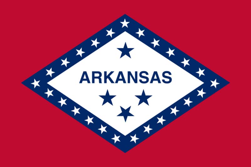 red flag with a blue rhomboid and white and blue stars featuring arkansas