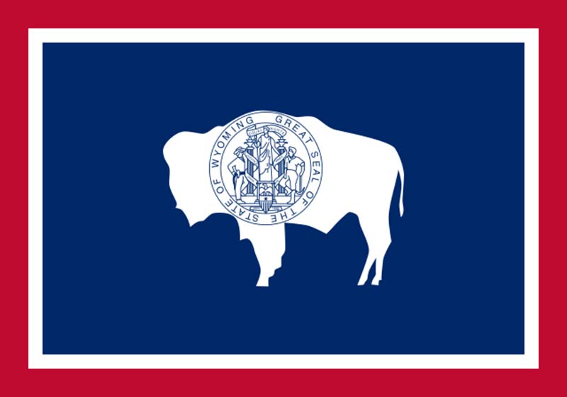 blue, white and red state flag featuring a white bull and wyoming great seal of the state