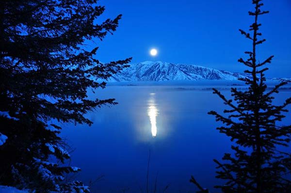 full moon lake and mountain view at night