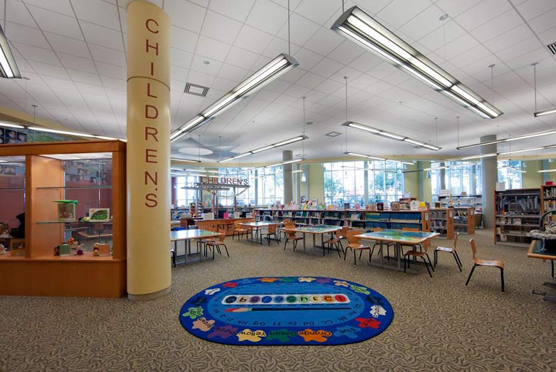 the interior of a library featuring a children area