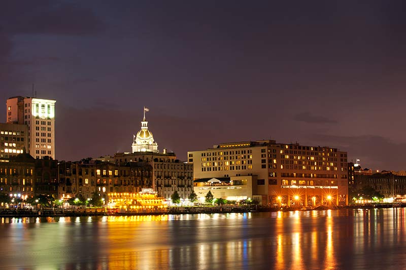 savannah at night with a city hall in behind