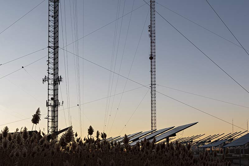 communication towers and solar panels in a middle of the field in shorewood, wisconsin