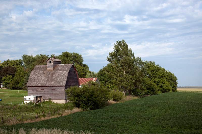 a view of a barn in green fields near st. joseph 