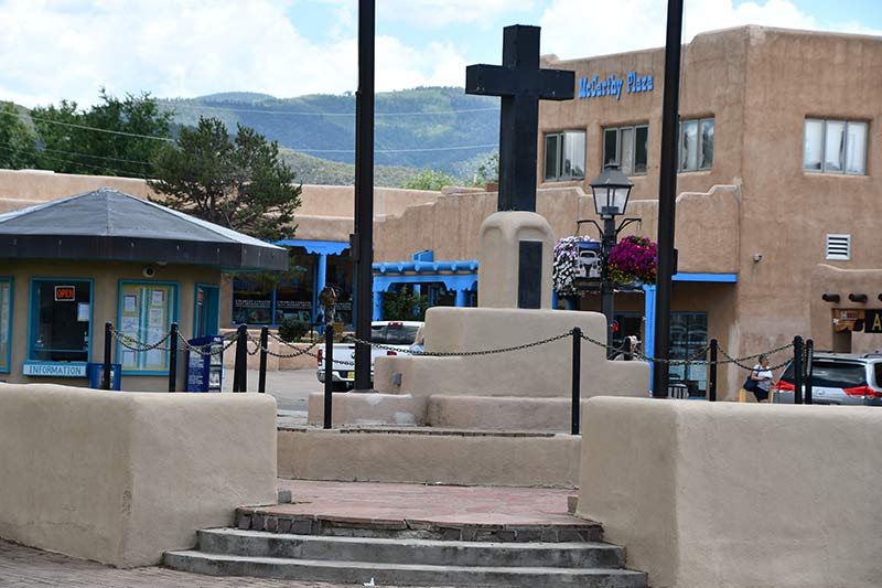 a monument in the downtown district of taos, new mexico